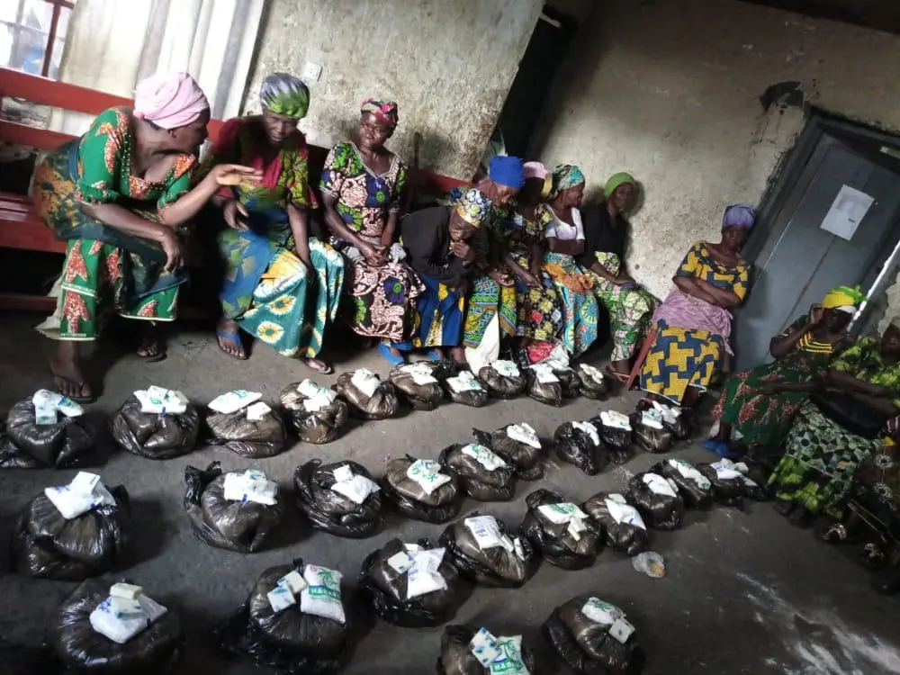 Widows receiving food supplies