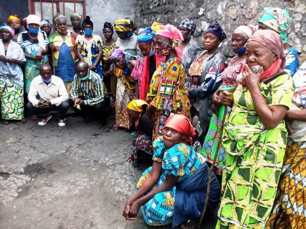 Widows gathered outside community center