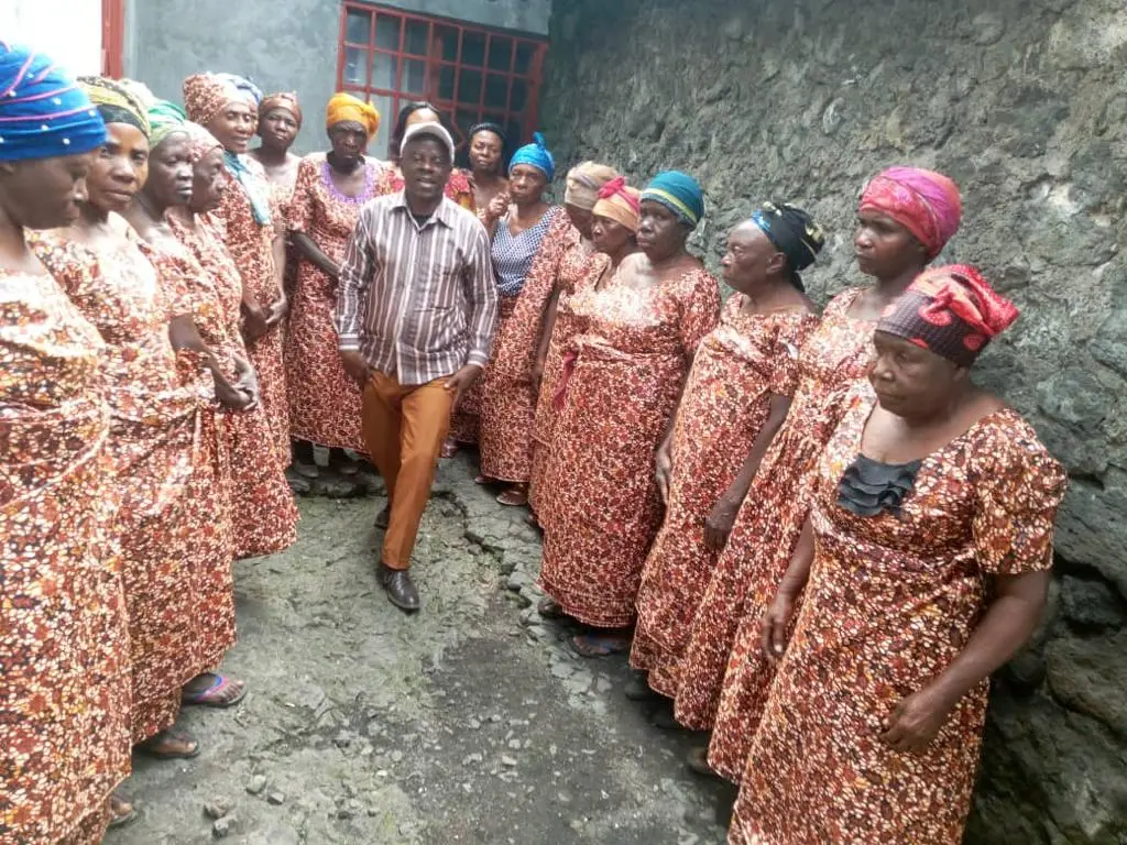 Elderly widows gathered in red