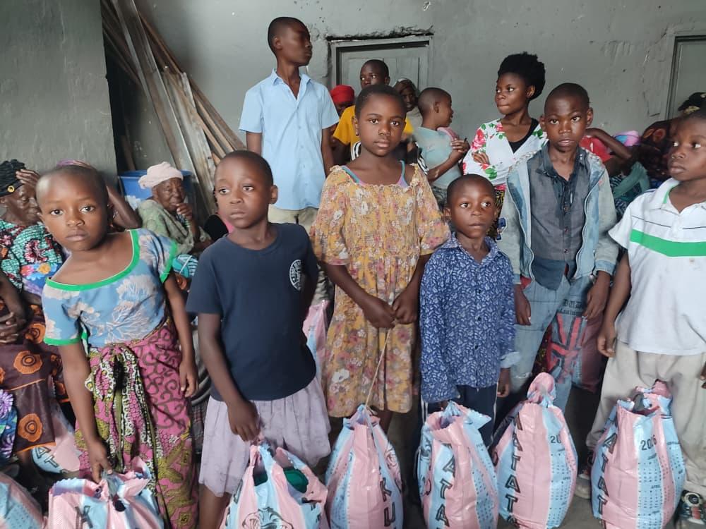 Children holding aid bags