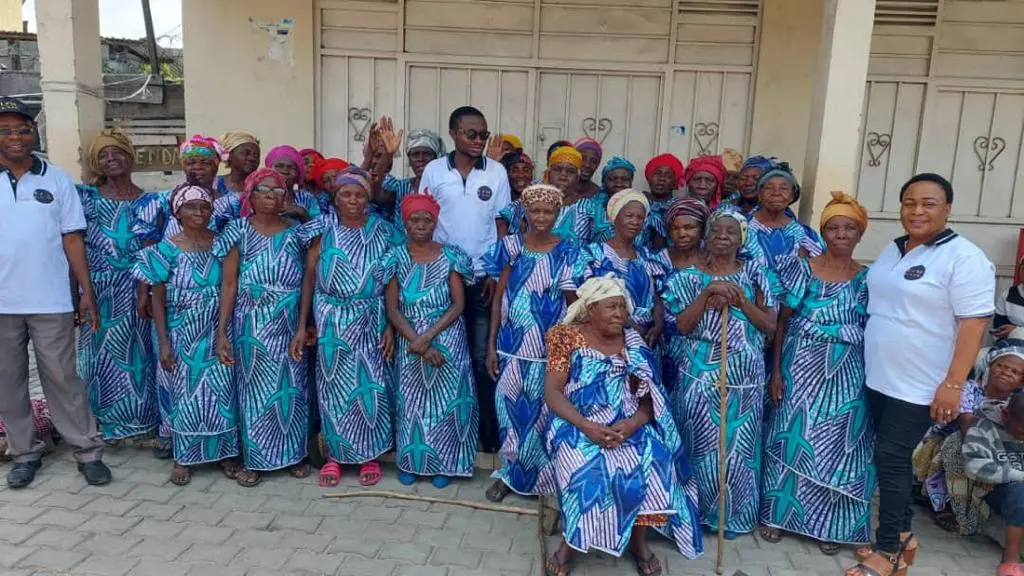 Elderly widows gathered in blue