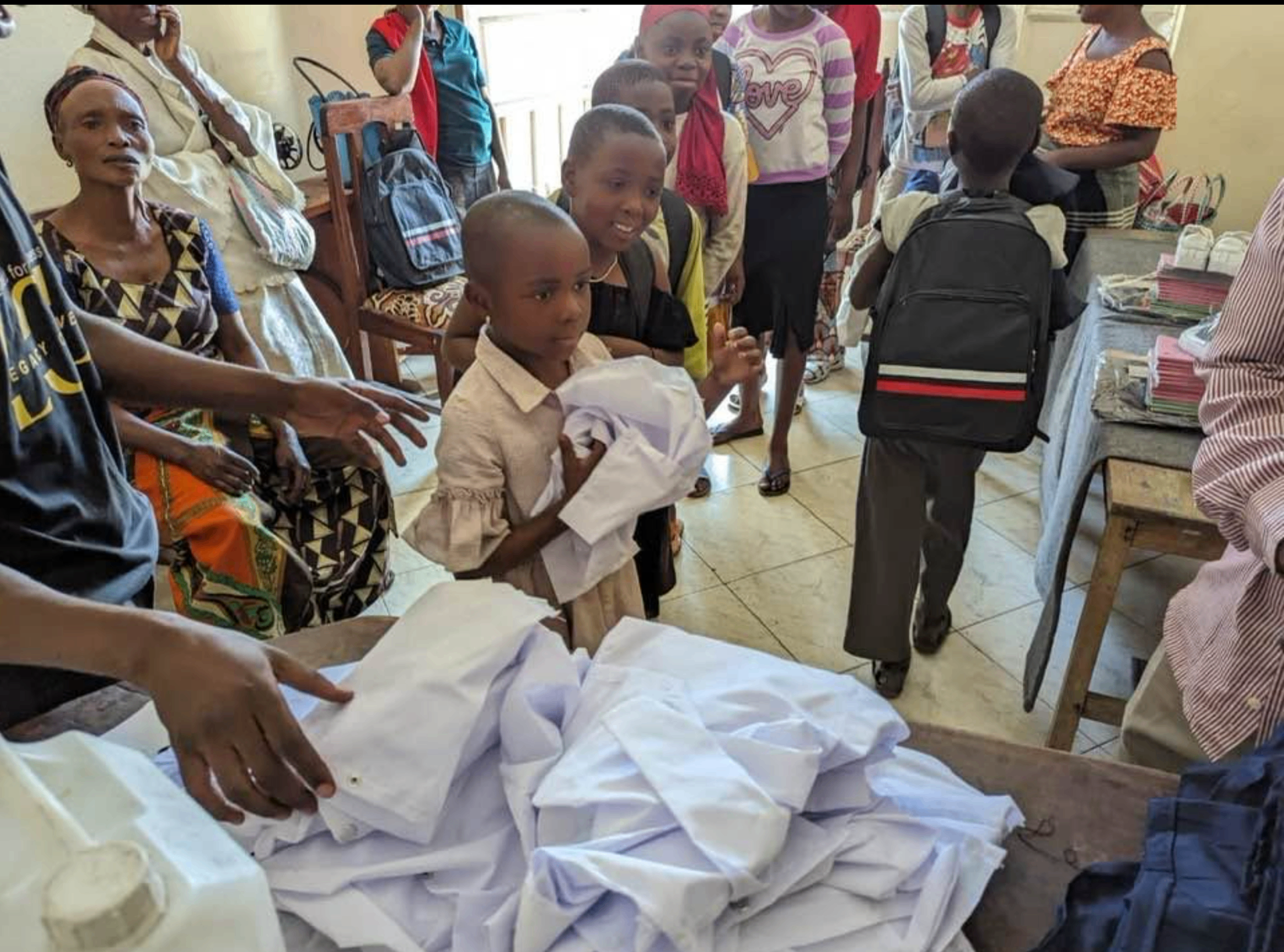 Children receiving new school uniforms