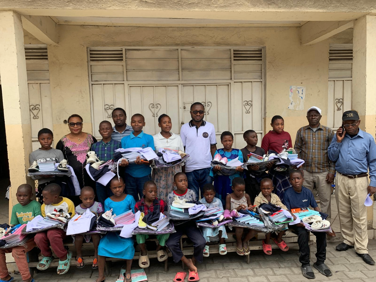Children and team with school supplies