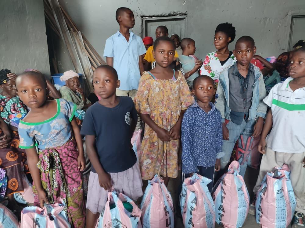 Children with relief bags at distribution