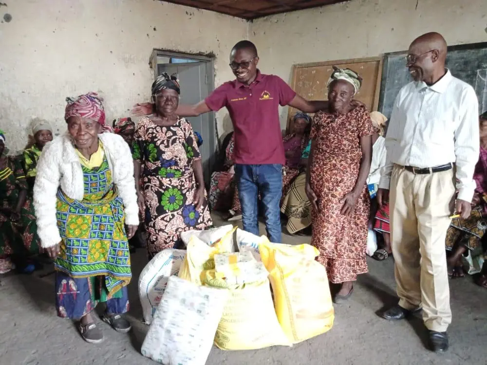 Elderly women receiving food bags